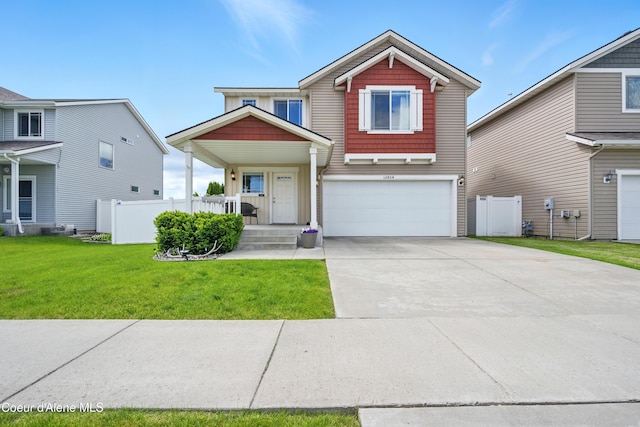 12404 W Devonshire Ave, Post Falls, ID 83854 - view of front facade featuring an attached garage and concrete driveway