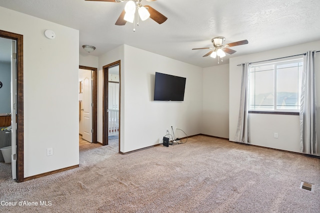 12404 W Devonshire Ave, Post Falls, ID 83854 - unfurnished living room featuring carpet flooring, ceiling fan, and baseboards