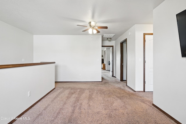 12404 W Devonshire Ave, Post Falls, ID 83854 - carpeted empty room with ceiling fan and baseboards