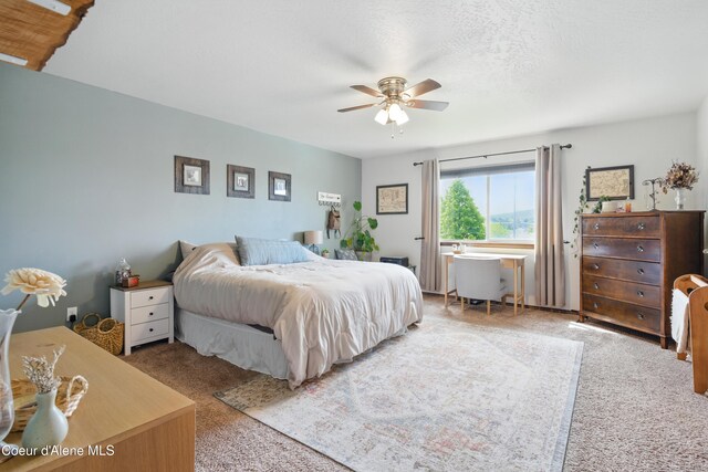 12404 W Devonshire Ave, Post Falls, ID 83854 - bedroom featuring carpet floors and ceiling fan