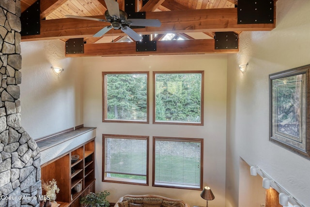 225 Fairway Dr, Priest Lake, ID 83856 - living room featuring beamed ceiling, a ceiling fan, and plenty of natural light