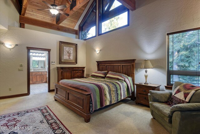 225 Fairway Dr, Priest Lake, ID 83856 - bedroom featuring light colored carpet, high vaulted ceiling, a textured wall, ensuite bathroom, and wood ceiling with exposed beams