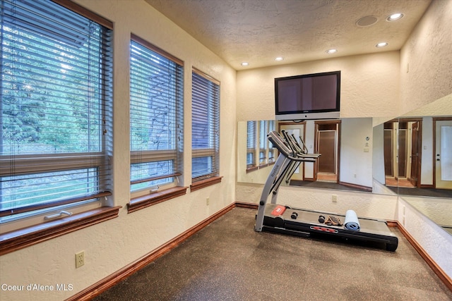 225 Fairway Dr, Priest Lake, ID 83856 - workout room with a textured wall, a textured ceiling, baseboards, and recessed lighting