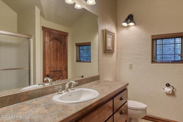 225 Fairway Dr, Priest Lake, ID 83856 - full bath with a textured wall, vanity, toilet, and a shower stall