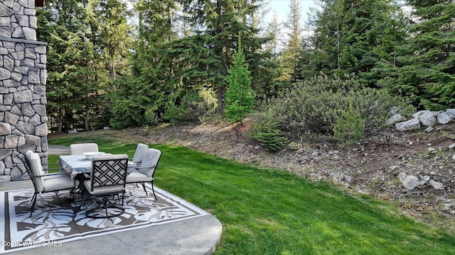 225 Fairway Dr, Priest Lake, ID 83856 - view of grassy yard featuring outdoor dining area and a patio area