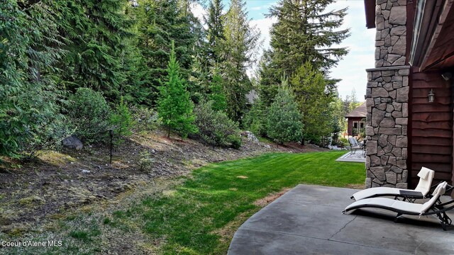 225 Fairway Dr, Priest Lake, ID 83856 - view of green lawn with a patio area