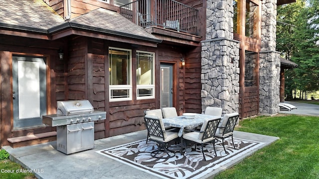 225 Fairway Dr, Priest Lake, ID 83856 - view of patio with a balcony, area for grilling, and outdoor dining area