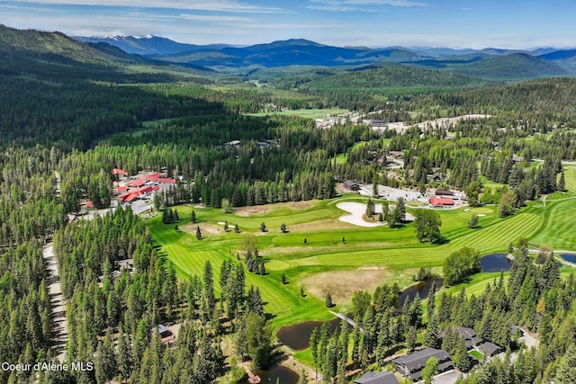 225 Fairway Dr, Priest Lake, ID 83856 - drone / aerial view of a heavily wooded area, mountains, and a golf course