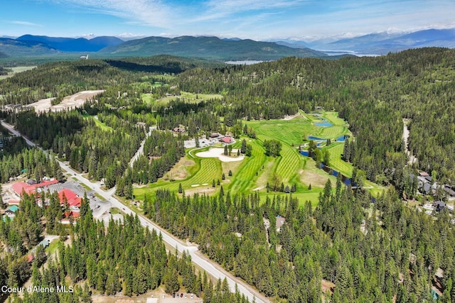 225 Fairway Dr, Priest Lake, ID 83856 - aerial view of property and surrounding area featuring a heavily wooded area and a mountainous background