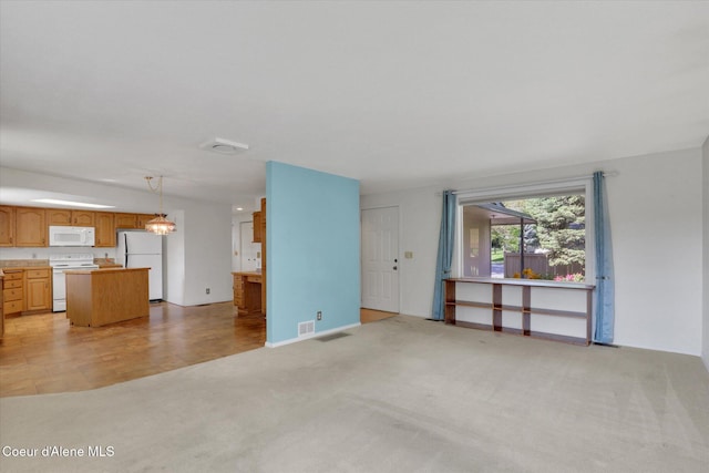 3012 N 4th St, Coeur Dalene, ID 83815 - unfurnished living room with light carpet