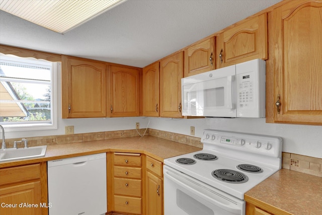 3012 N 4th St, Coeur Dalene, ID 83815 - kitchen with white appliances, a sink, and light countertops