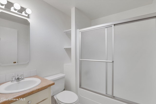 3012 N 4th St, Coeur Dalene, ID 83815 - bathroom featuring vanity, toilet, backsplash, and enclosed tub / shower combo