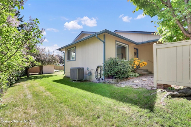 3012 N 4th St, Coeur Dalene, ID 83815 - view of property exterior with central AC and a storage unit