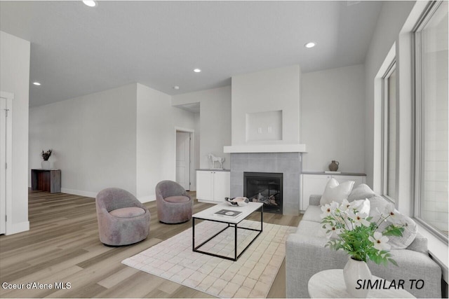 1109 N Country Club Dr Unit 22, Deer Park, WA 99006 - living area with a fireplace, light wood-type flooring, recessed lighting, and baseboards