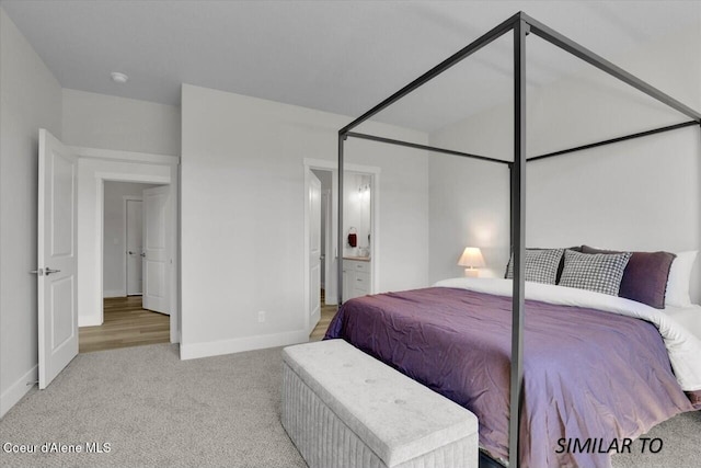 1109 N Country Club Dr Unit 22, Deer Park, WA 99006 - carpeted bedroom with baseboards and ensuite bathroom