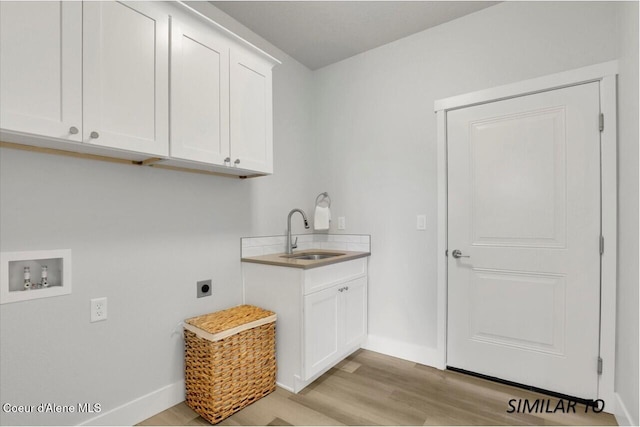 1109 N Country Club Dr Unit 22, Deer Park, WA 99006 - laundry room featuring cabinet space, hookup for an electric dryer, baseboards, and light wood-type flooring