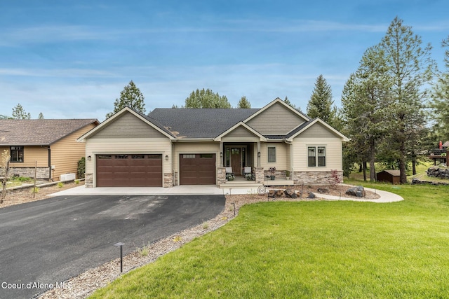396 Hanaford Rd, Blanchard, ID 83804 - craftsman house with stone siding, a garage, driveway, and a front lawn