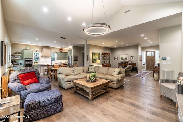396 Hanaford Rd, Blanchard, ID 83804 - living room featuring light wood finished floors, recessed lighting, and high vaulted ceiling