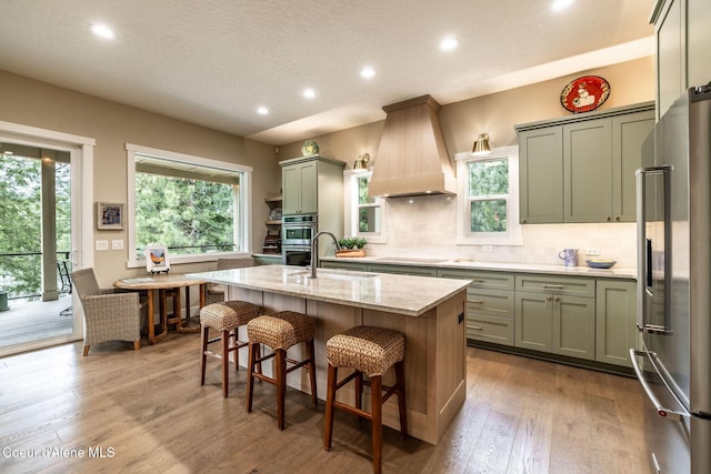 396 Hanaford Rd, Blanchard, ID 83804 - kitchen with appliances with stainless steel finishes, recessed lighting, plenty of natural light, light stone countertops, and tasteful backsplash