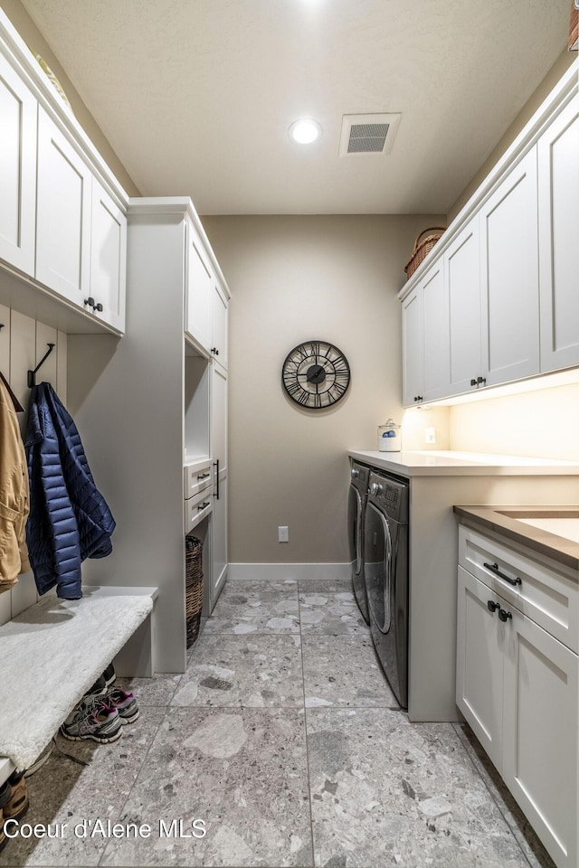 396 Hanaford Rd, Blanchard, ID 83804 - laundry area featuring cabinet space, washer and clothes dryer, baseboards, and recessed lighting