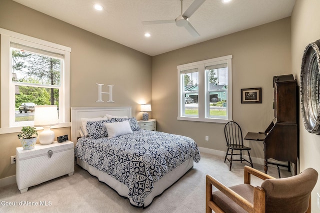 396 Hanaford Rd, Blanchard, ID 83804 - bedroom with light colored carpet, multiple windows, baseboards, recessed lighting, and a ceiling fan
