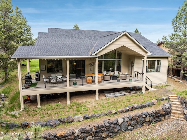 396 Hanaford Rd, Blanchard, ID 83804 - rear view of house featuring a wooden deck, a shingled roof, and outdoor dining space
