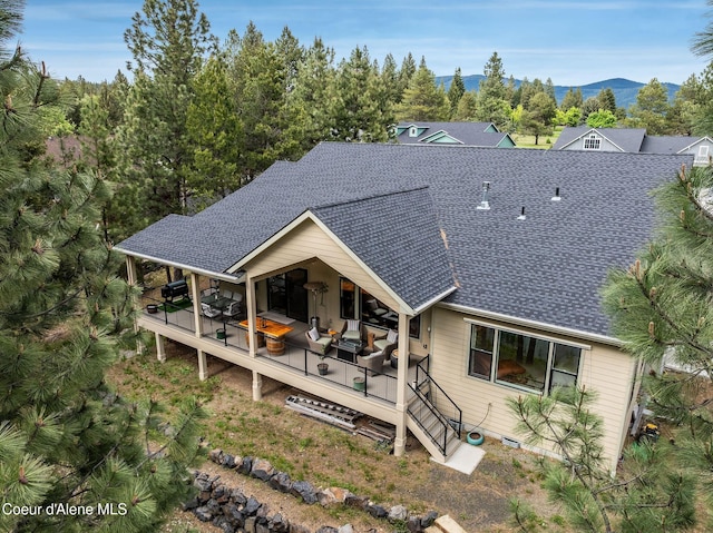 396 Hanaford Rd, Blanchard, ID 83804 - rear view of house with roof with shingles and a deck with mountain view
