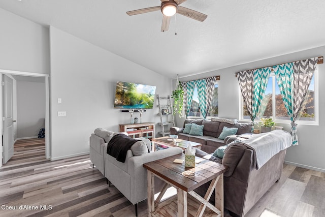 3283 N Knob Creek Ct, Post Falls, ID 83854 - living area featuring a ceiling fan, light wood finished floors, lofted ceiling, and baseboards