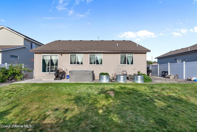 3283 N Knob Creek Ct, Post Falls, ID 83854 - rear view of property with a patio area and a hot tub