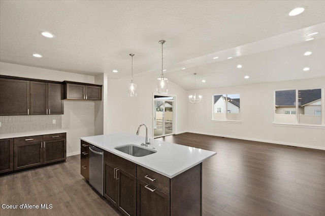 3387 N Cyprus Fox Loop, Post Falls, ID 83854 - kitchen with a sink, stainless steel dishwasher, dark wood finished floors, light countertops, and dark brown cabinets