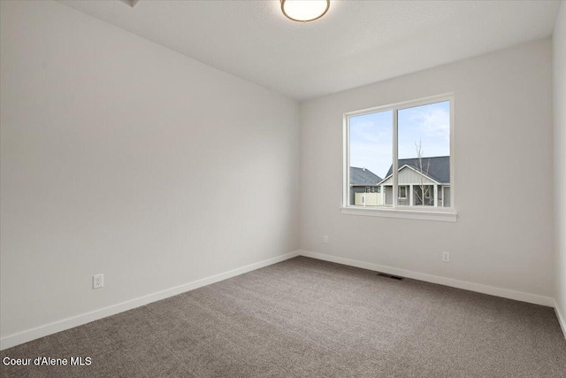 3387 N Cyprus Fox Loop, Post Falls, ID 83854 - unfurnished room featuring baseboards and carpet floors