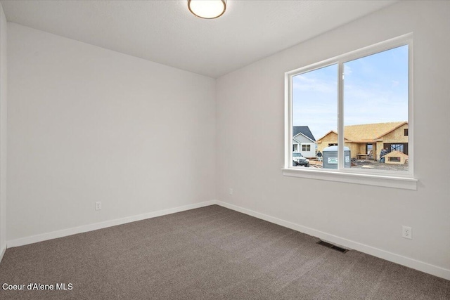 3387 N Cyprus Fox Loop, Post Falls, ID 83854 - carpeted empty room with baseboards