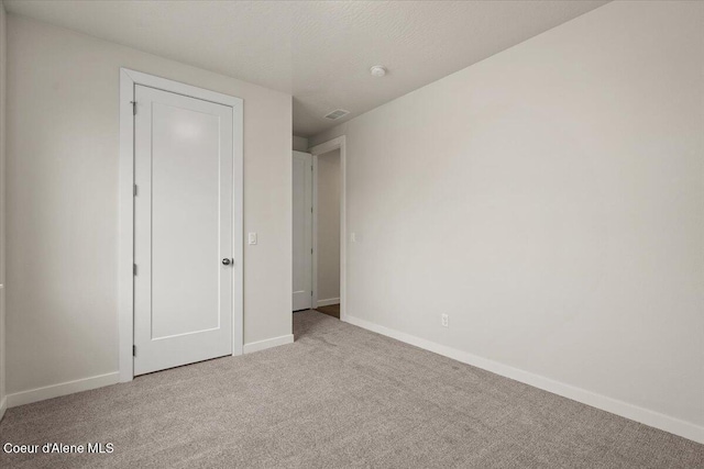 3387 N Cyprus Fox Loop, Post Falls, ID 83854 - unfurnished bedroom featuring carpet floors and baseboards