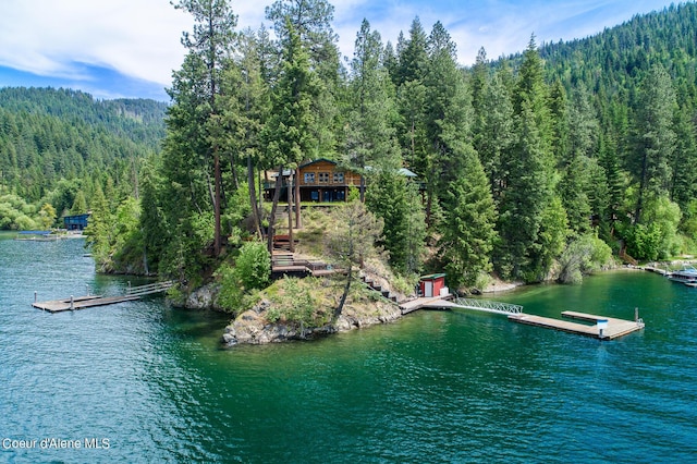 8457 N Powell Way, Hayden, ID 83835 - water view featuring a forest and a floating dock