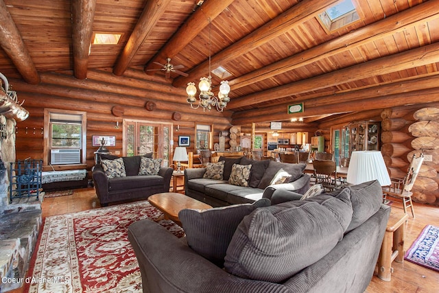 8457 N Powell Way, Hayden, ID 83835 - living area with a skylight, wood ceiling with exposed beams, hardwood / wood-style floors, a chandelier, and cooling unit