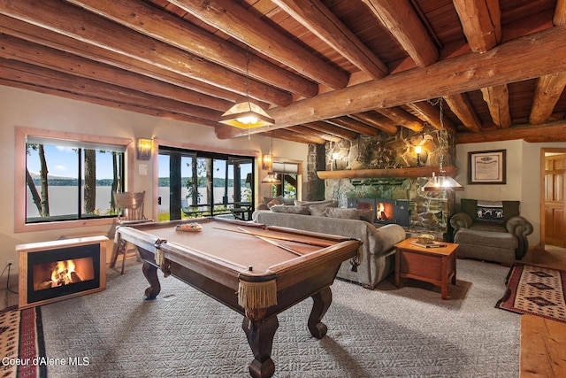 8457 N Powell Way, Hayden, ID 83835 - rec room featuring a fireplace, billiards, wooden ceiling with exposed beams, carpet, and a water view