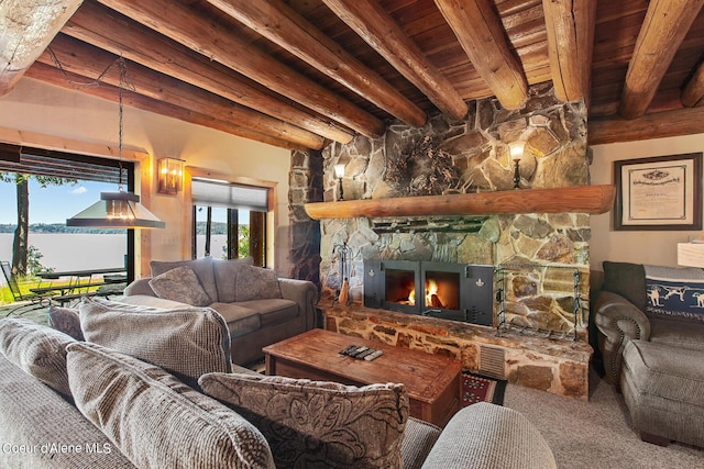 8457 N Powell Way, Hayden, ID 83835 - carpeted living area with wooden ceiling with exposed beams, a stone fireplace, and a water view