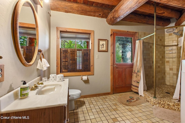 8457 N Powell Way, Hayden, ID 83835 - bathroom with vanity, a shower stall, toilet, tile patterned flooring, and wood ceiling with exposed beams
