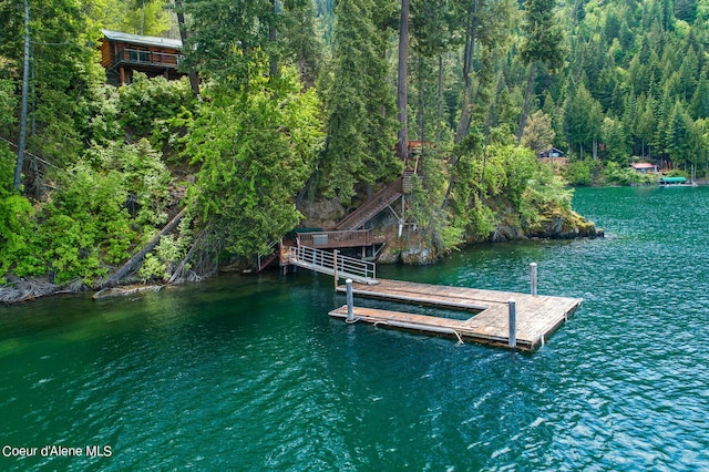 8457 N Powell Way, Hayden, ID 83835 - dock featuring a water view and a view of trees