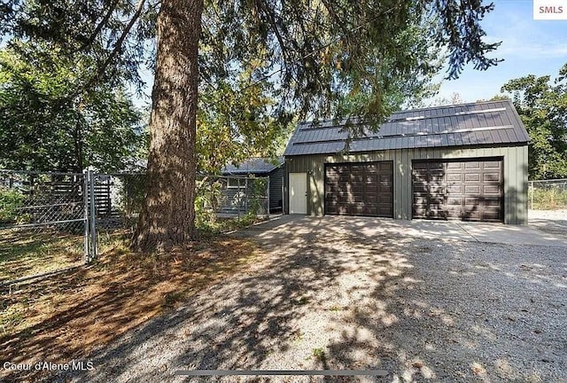31961 N 3rd Ave, Spirit Lake, ID 83869 - view of front of home with a garage and an outdoor structure