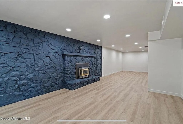 31961 N 3rd Ave, Spirit Lake, ID 83869 - unfurnished living room featuring wood finished floors, recessed lighting, and baseboards