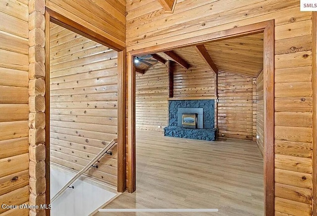 31961 N 3rd Ave, Spirit Lake, ID 83869 - stairs featuring wooden walls, wood finished floors, wooden ceiling, and a stone fireplace
