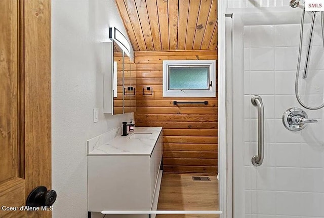 31961 N 3rd Ave, Spirit Lake, ID 83869 - full bathroom with a shower, wood ceiling, vanity, wooden walls, and wood finished floors