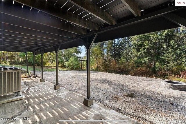 31961 N 3rd Ave, Spirit Lake, ID 83869 - view of patio / terrace featuring central AC unit and a fire pit