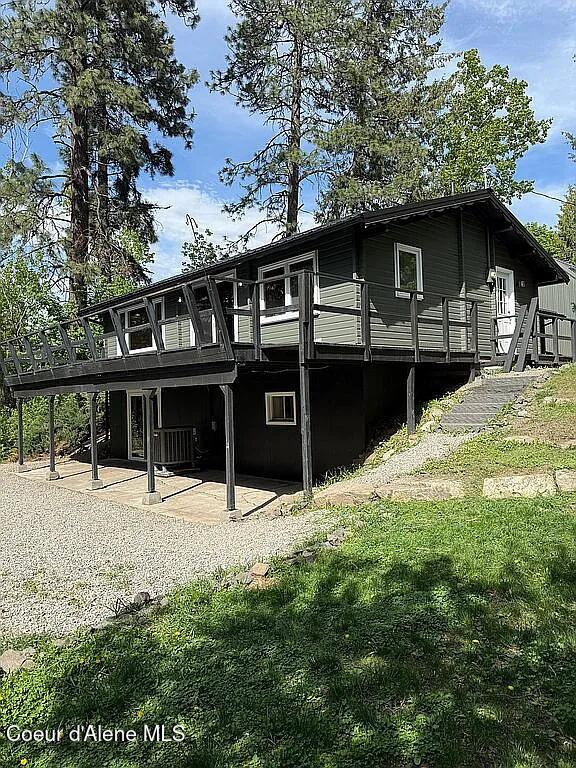 31961 N 3rd Ave, Spirit Lake, ID 83869 - back of property featuring a patio area, a deck, and a yard