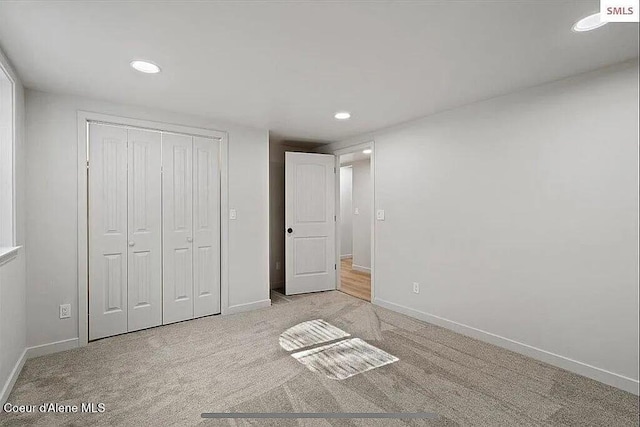 31961 N 3rd Ave, Spirit Lake, ID 83869 - unfurnished bedroom featuring recessed lighting, baseboards, a closet, and carpet floors
