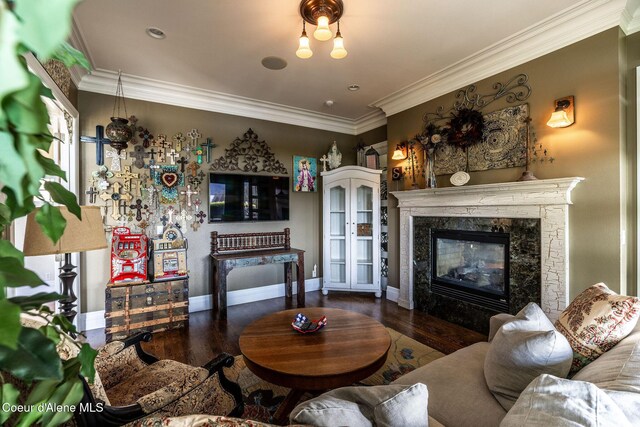 4878 E Annapolis Ct, Coeur Dalene, ID 83814 - living area with crown molding, wood finished floors, a high end fireplace, and baseboards