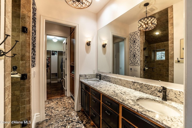 4878 E Annapolis Ct, Coeur Dalene, ID 83814 - full bath with double vanity, tiled shower, and a spacious closet