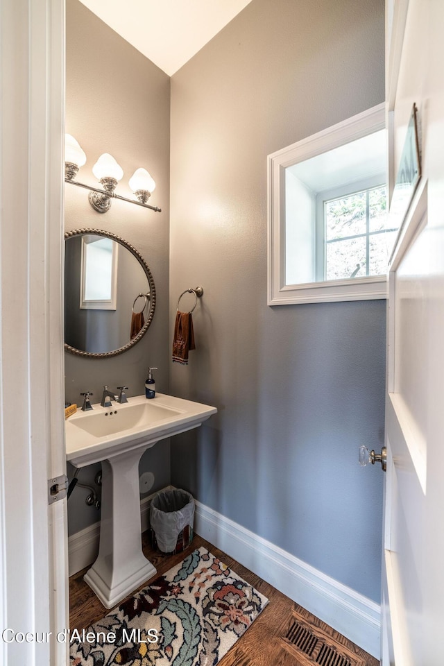 4878 E Annapolis Ct, Coeur Dalene, ID 83814 - bathroom with baseboards and wood finished floors