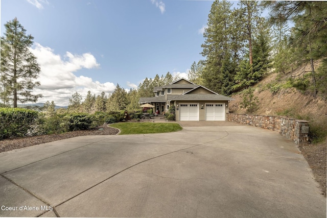4878 E Annapolis Ct, Coeur Dalene, ID 83814 - view of front of house with concrete driveway, an attached garage, and a front yard